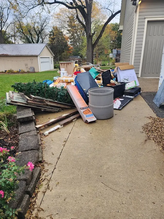 Dumpster being loaded with debris for 30 Yard Dumpster Rental in Cohoctah